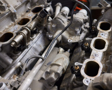 Engine valve car maintenance. The cylinder block of the four-cylinder engine. Disassembled motor vehicle for repair.