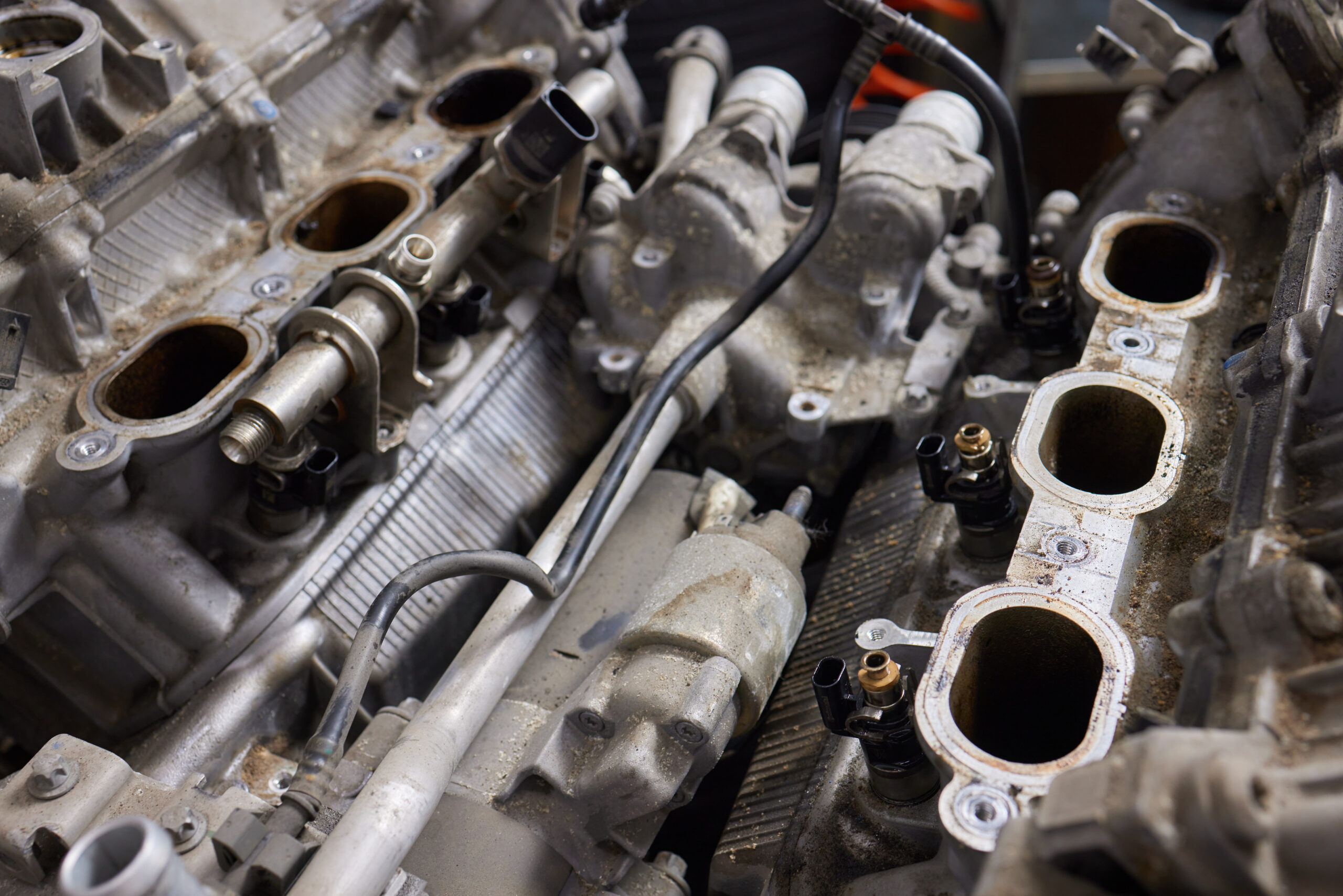 Engine valve car maintenance. The cylinder block of the four-cylinder engine. Disassembled motor vehicle for repair.